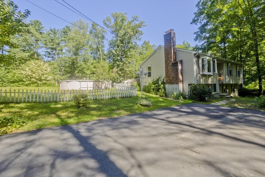 288 Fisk Road Hardwick, MA 01082 - Photo 4 of 42 a view of a house with a yard and a garden