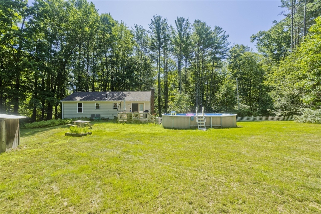 288 Fisk Road Hardwick, MA 01082 - Photo 6 of 42 a view of a swimming pool with an outdoor seating and a yard