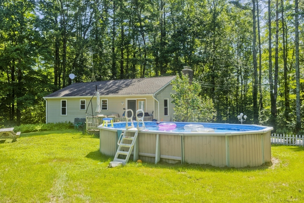 288 Fisk Road Hardwick, MA 01082 - Photo 8 of 42 a view of a house with a yard and sitting area