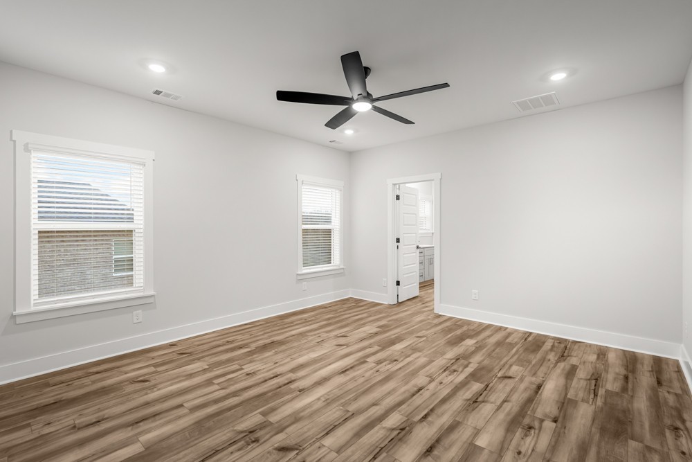 404 Springbrook Boulevard White House, TN 37188 - Photo 13 of 31 a view of empty room with wooden floor and fan