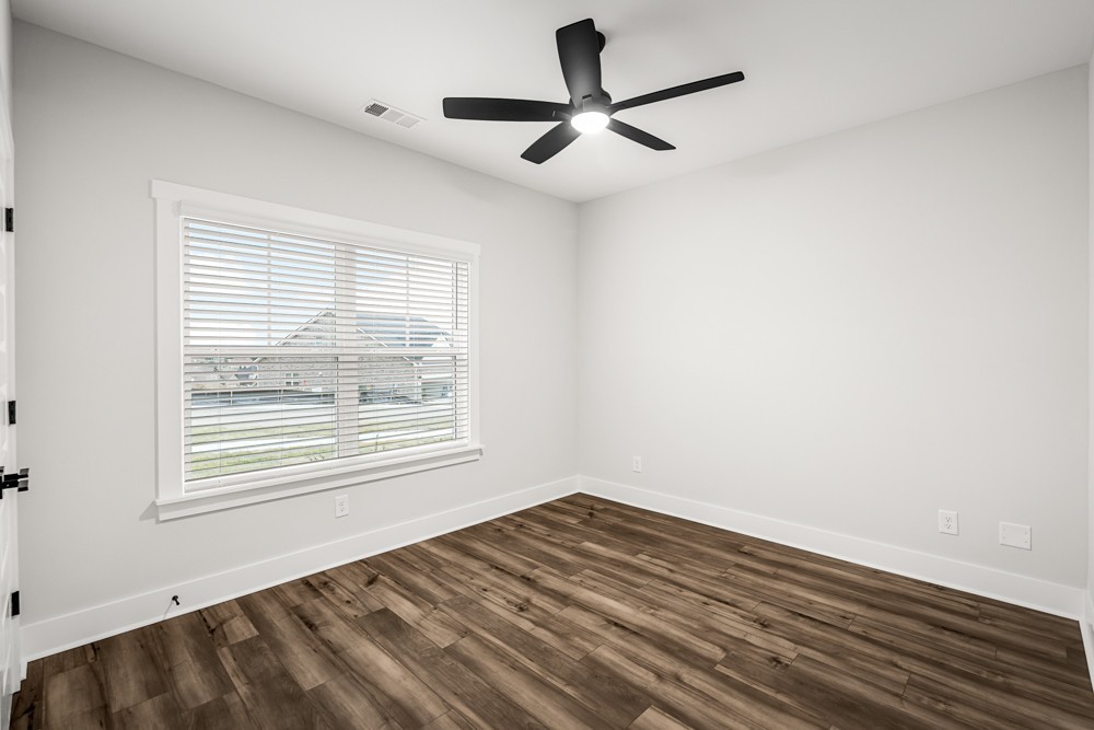 404 Springbrook Boulevard White House, TN 37188 - Photo 18 of 31 a view of empty room with wooden floor and fan