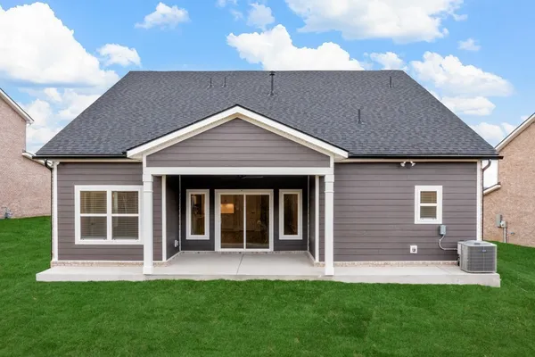 a front view of a house with a yard and porch