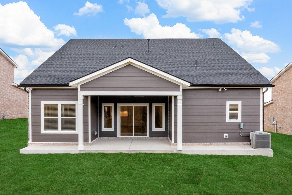 404 Springbrook Boulevard White House, TN 37188 - Photo 28 of 31 a front view of a house with a yard and porch