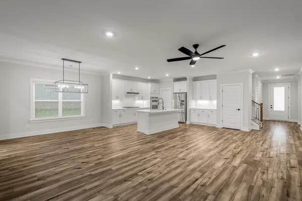 a view of a kitchen with microwave and cabinets