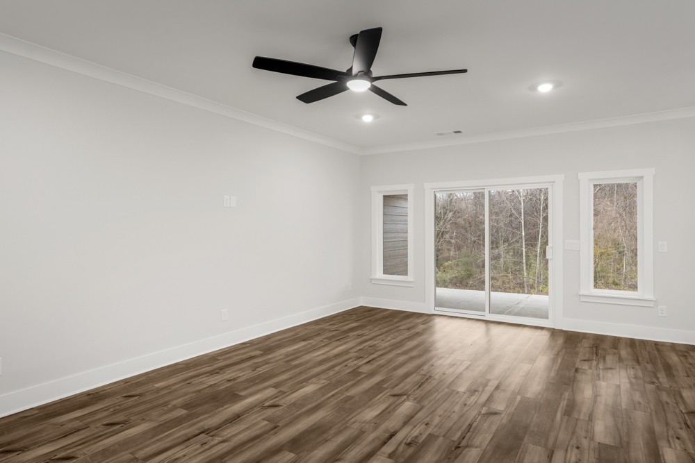 404 Springbrook Boulevard White House, TN 37188 - Photo 5 of 31 a view of an empty room with wooden floor and a window