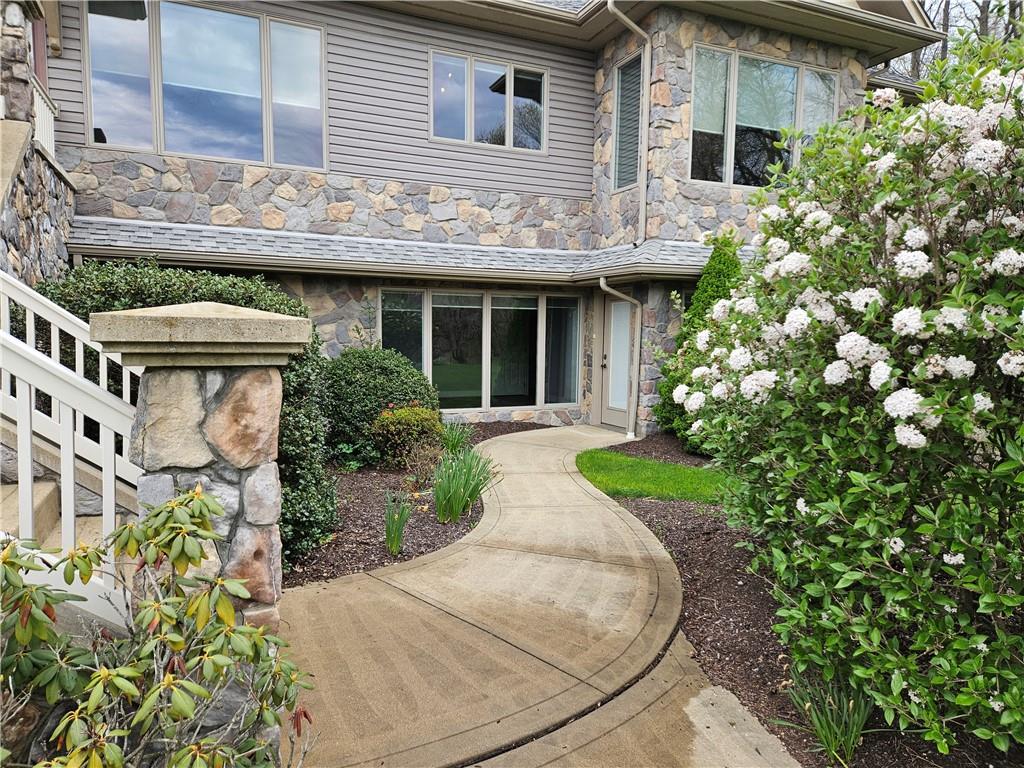 1845 Ferguson Road Allison Park, PA 15101 - Photo 4 of 50 a view of brick house with potted plants and a table and chairs