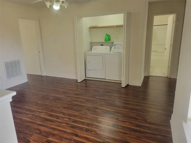 a view of a kitchen from the hallway