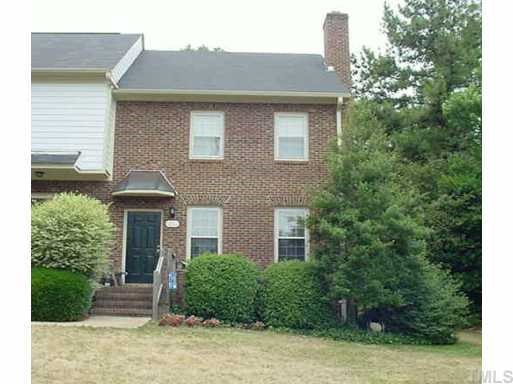 6221 Waterside Lane Raleigh, NC 27613 - Photo 1 of 1 a front view of a house with a yard and potted plants