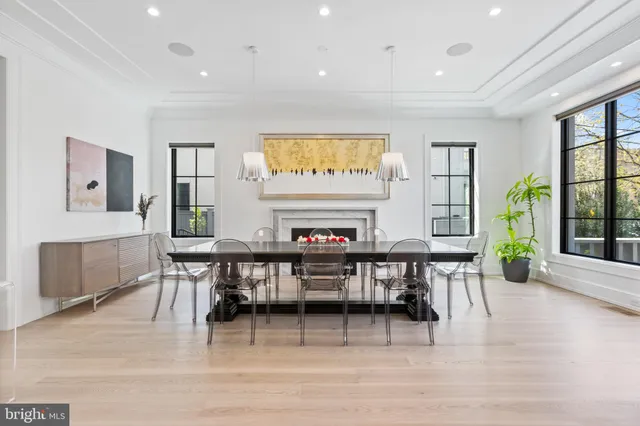 a view of a a dining room with furniture window and wooden floor