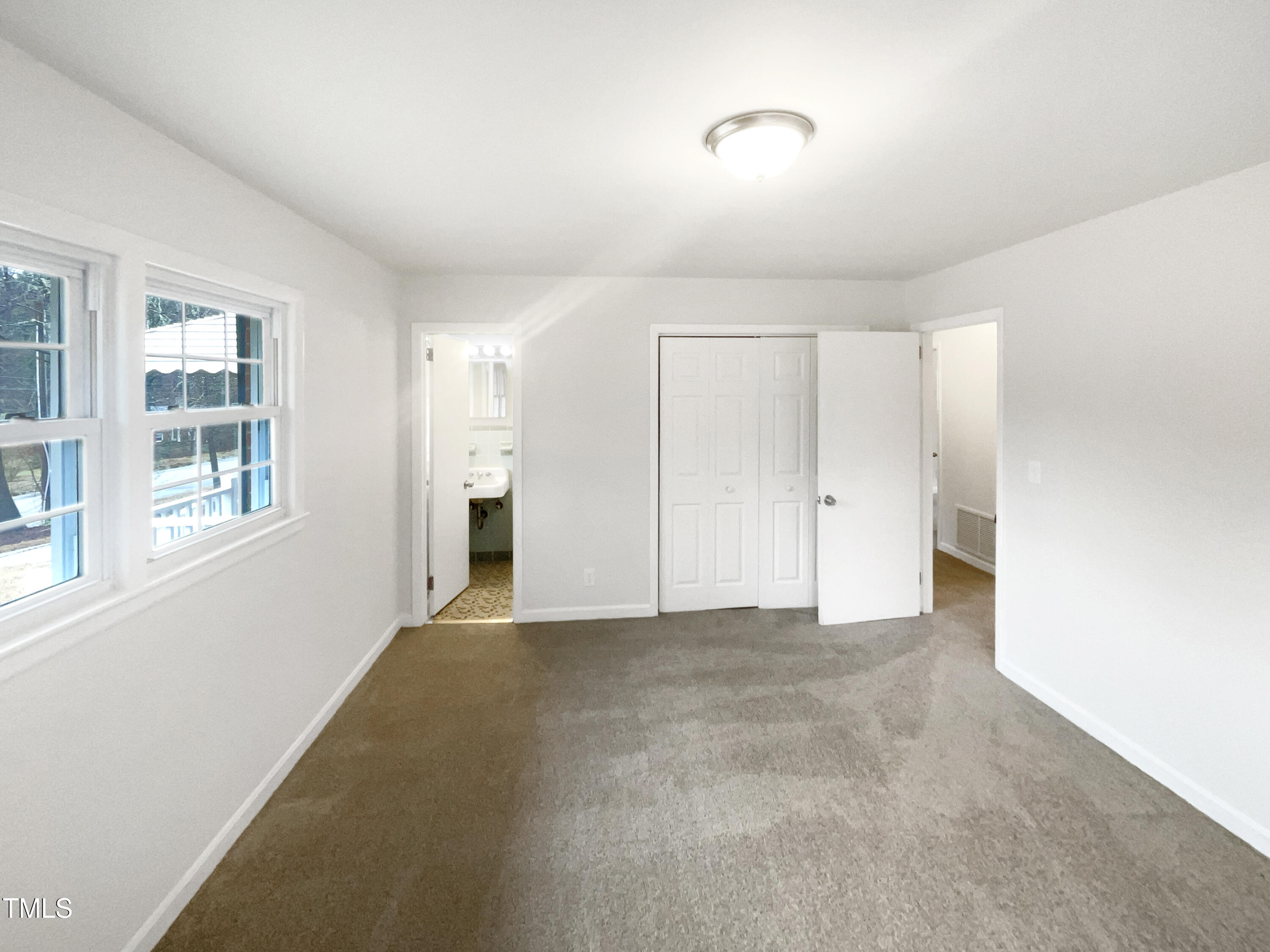 623 Sybil Drive Durham, NC 27703 - Photo 11 of 18 a view of an empty room with a window