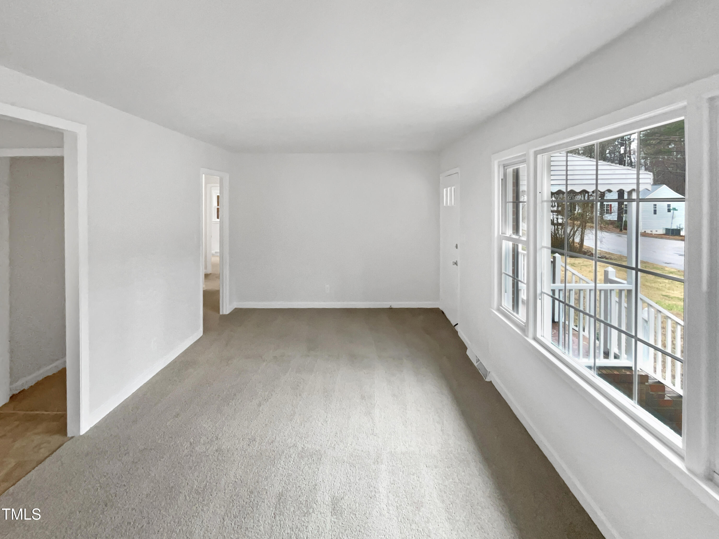 623 Sybil Drive Durham, NC 27703 - Photo 12 of 18 wooden floor in an empty room with a window