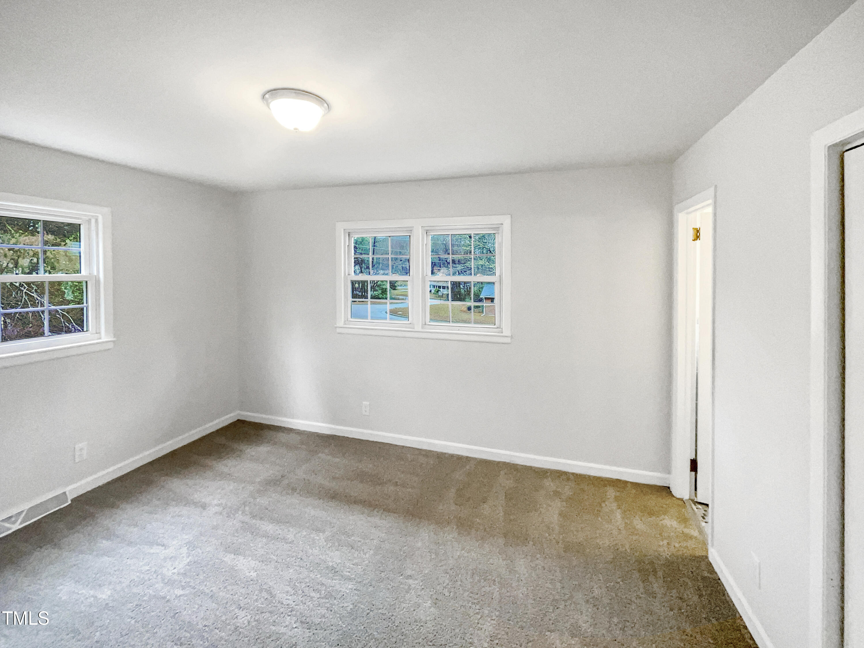 623 Sybil Drive Durham, NC 27703 - Photo 15 of 18 an empty room with windows