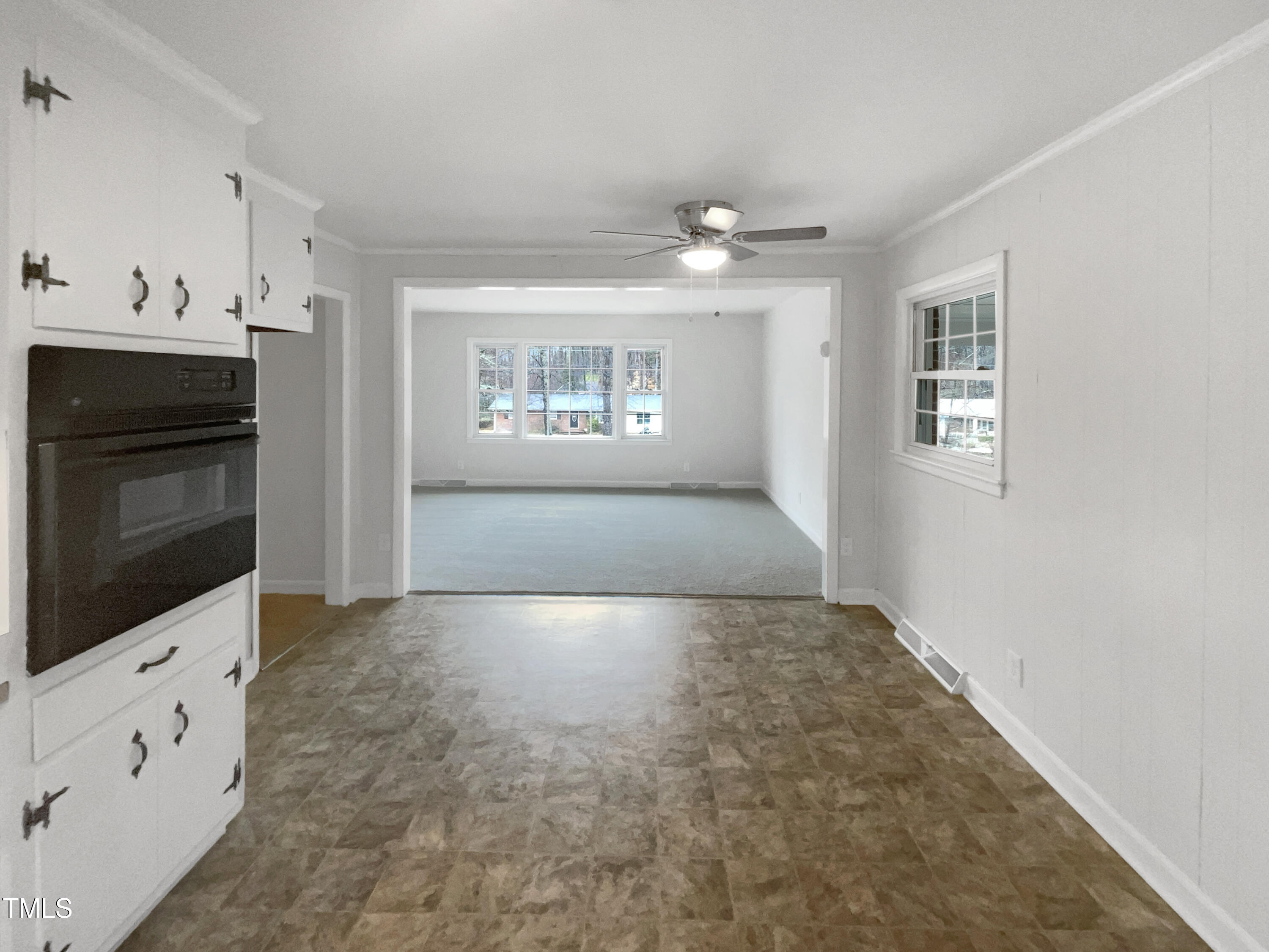 623 Sybil Drive Durham, NC 27703 - Photo 7 of 18 a view of an empty room with a fireplace