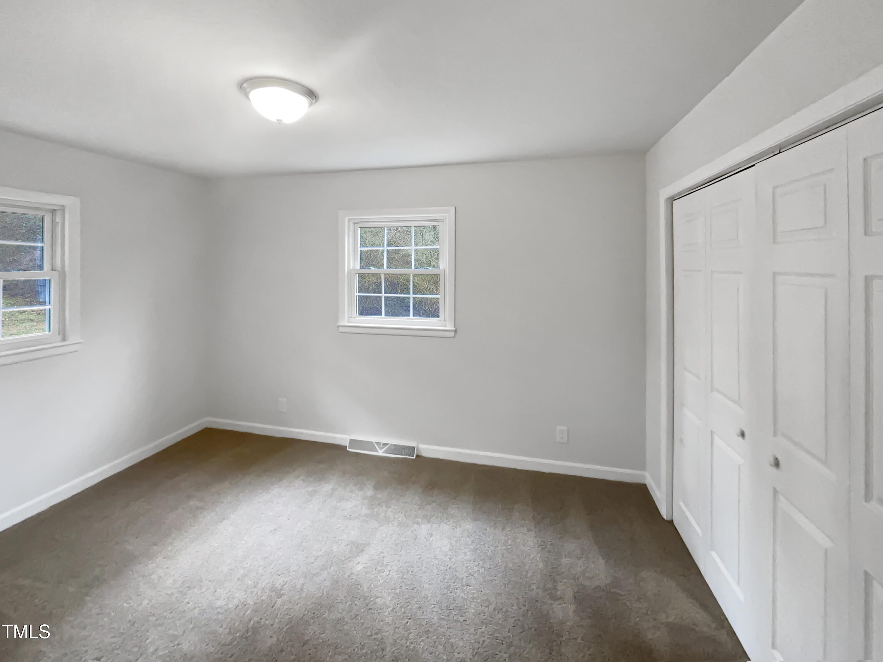 623 Sybil Drive Durham, NC 27703 - Photo 9 of 18 an empty room with a window