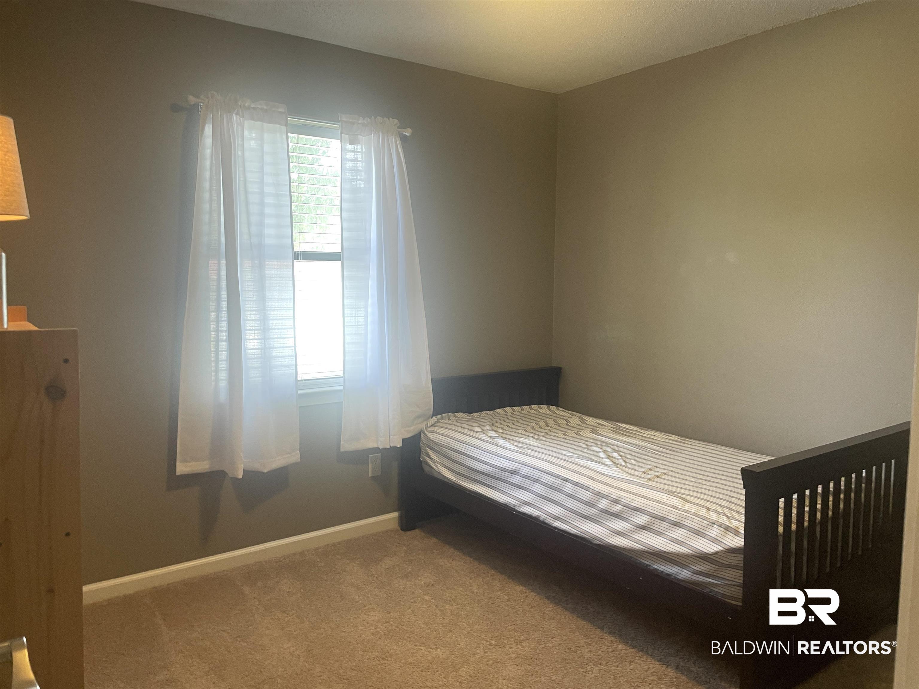 2274 Foshee Road Brewton, AL 36426 - Photo 16 of 23 Bedroom featuring carpet flooring and baseboards