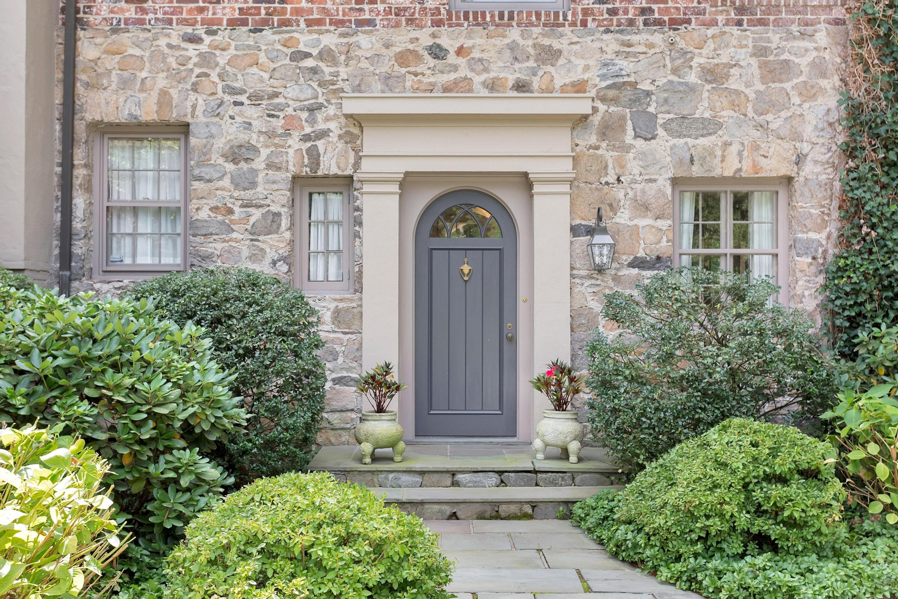 30 Old Farm Road Darien, CT 06820 - Photo 3 of 42 front view of a small house with potted plants