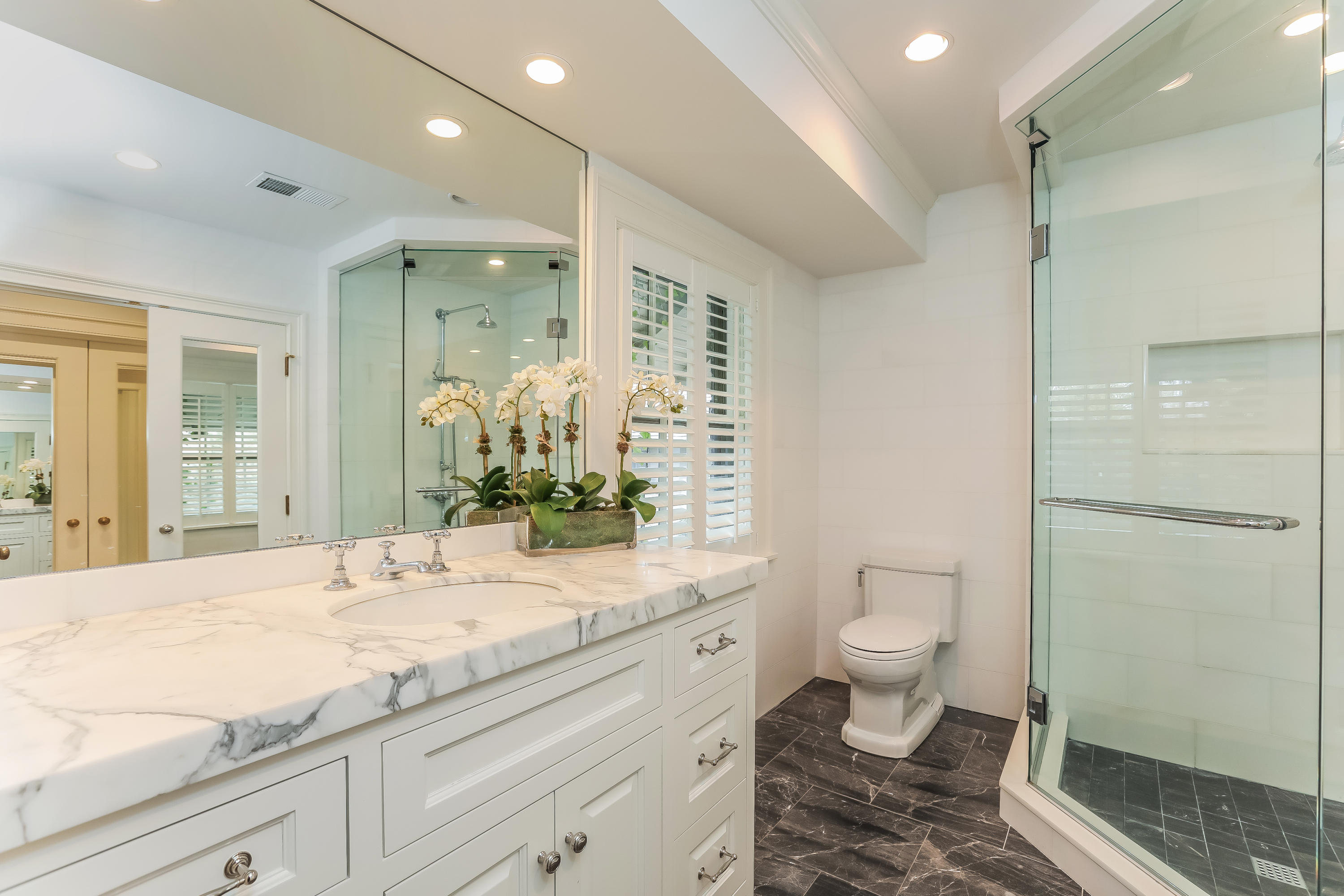 30 Old Farm Road Darien, CT 06820 - Photo 22 of 42 a bathroom with a granite countertop sink a toilet and shower