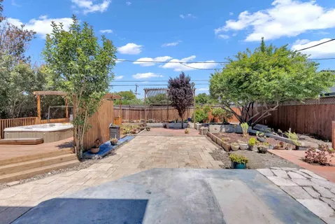 an aerial view of a house with a swimming pool yard and outdoor seating