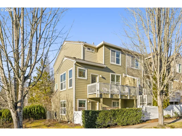 a front view of a residential apartment building with a yard