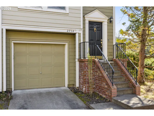 front view of a house with a small yard