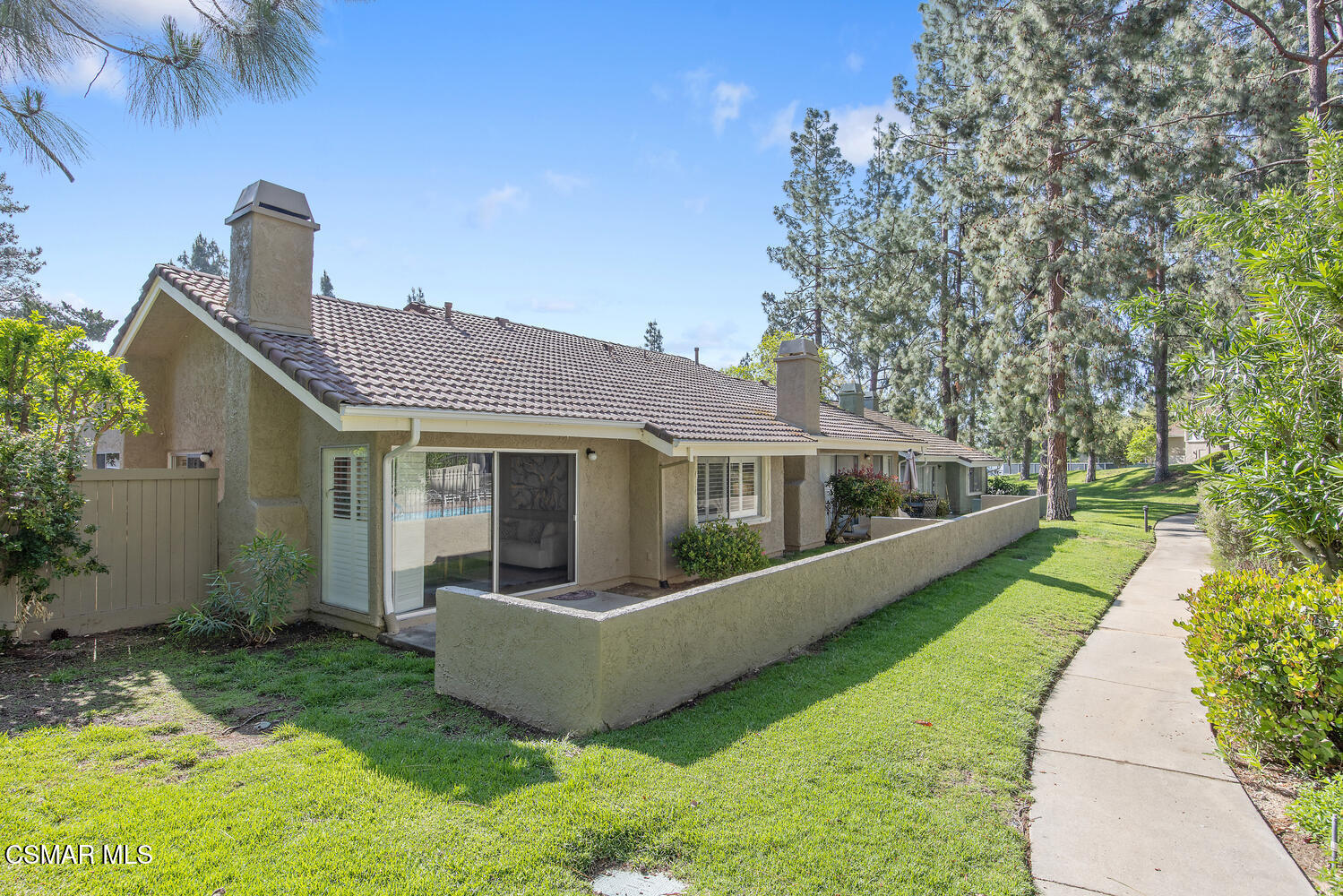 175 Conifer Circle Oak Park, CA 91377 - Photo 17 of 20 a front view of a house with yard and glass windows