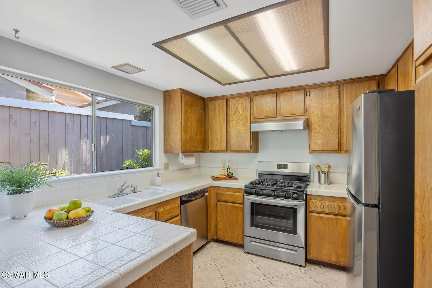 175 Conifer Circle Oak Park, CA 91377 - Photo 8 of 20 a kitchen with a sink a counter and cabinets