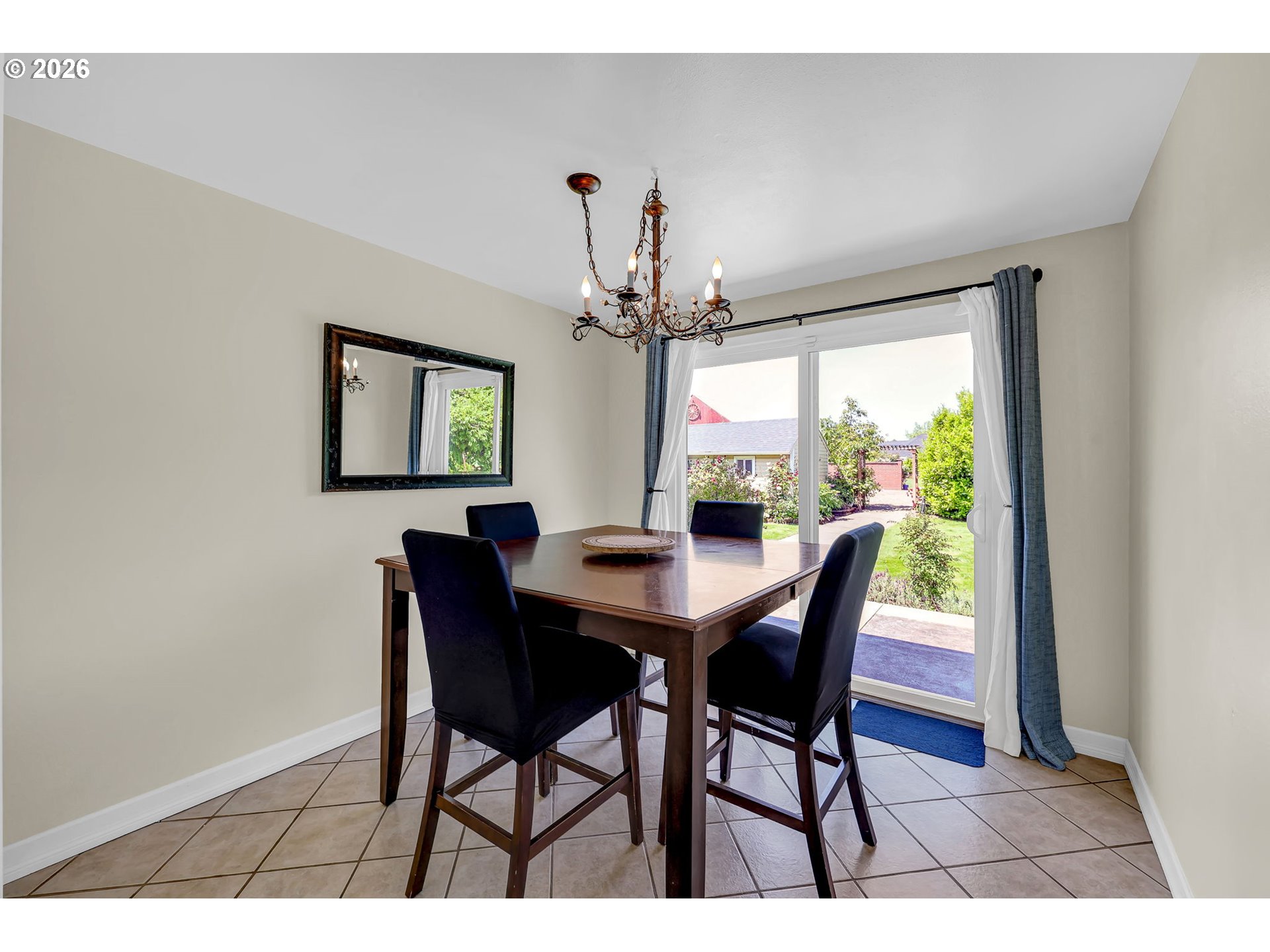 90440 Goodman Road Junction City, OR 97448 - Photo 12 of 48 a view of a dining room with furniture wooden floor and chandelier
