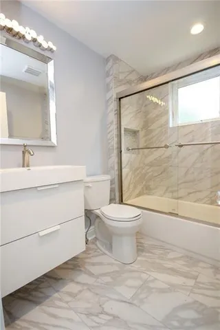 a bathroom with a toilet sink and a bathtub