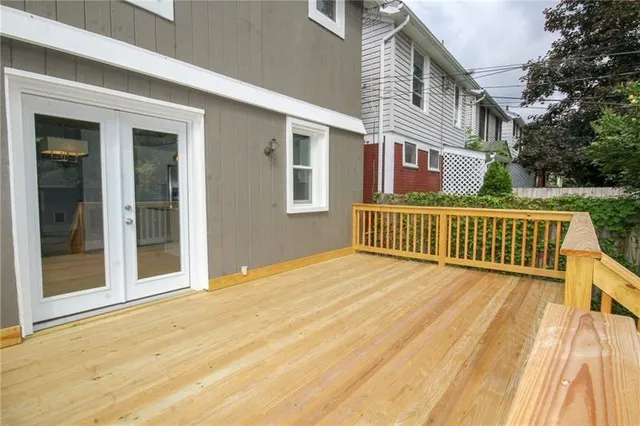 a view of a brick house with many windows