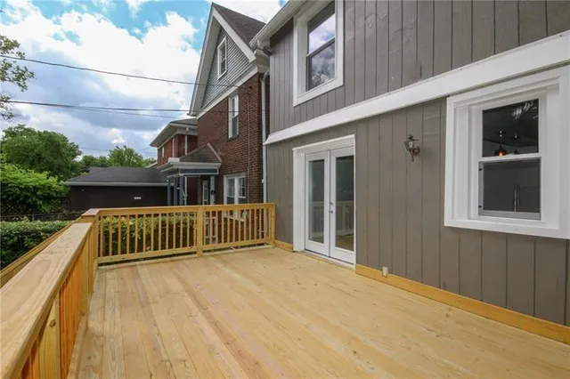 a view of balcony with deck and furniture