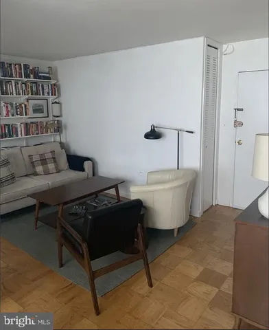 a living room with furniture and a rug