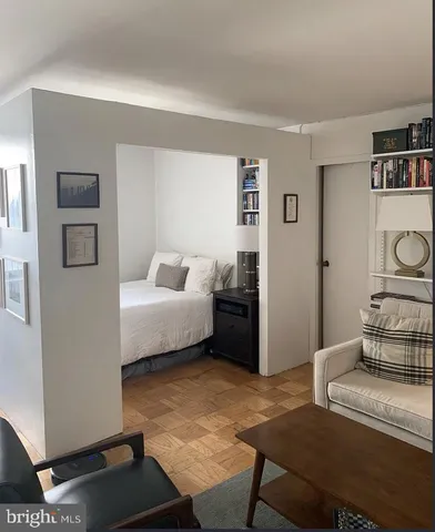 a bedroom with a bed and cabinets