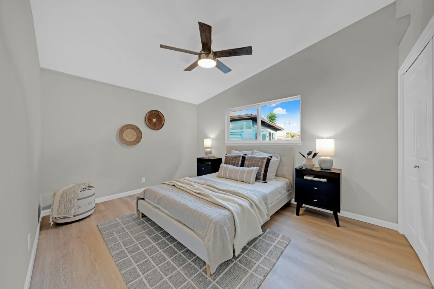 1775 Ravizza Avenue Santa Clara, CA 95051 - Photo 23 of 41 a bedroom with a bed and cabinets