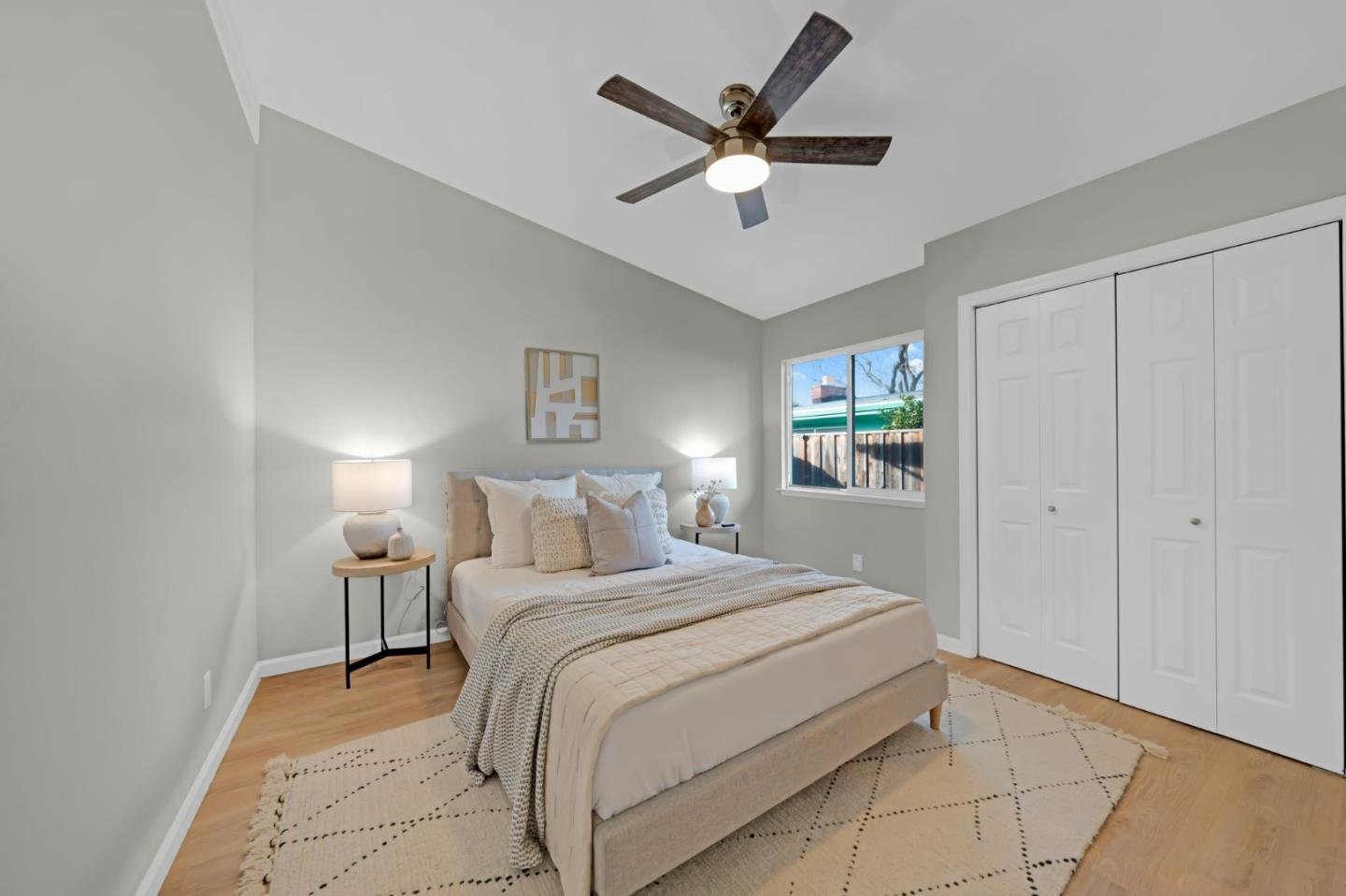 1775 Ravizza Avenue Santa Clara, CA 95051 - Photo 25 of 41 a bedroom with a large bed and a chandelier