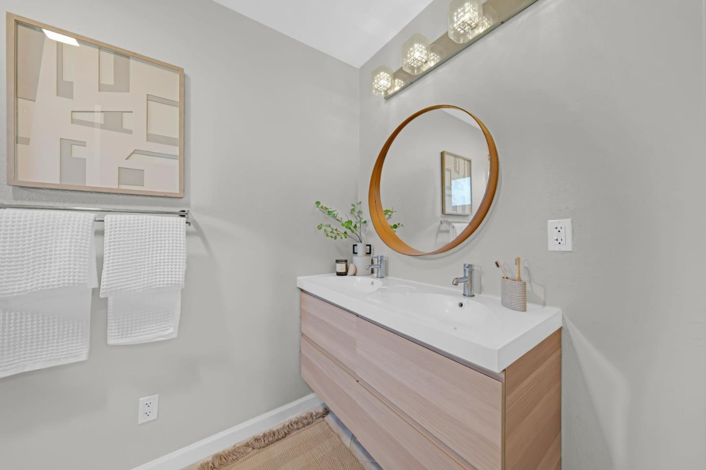 1775 Ravizza Avenue Santa Clara, CA 95051 - Photo 27 of 41 a bathroom with a sink and a mirror
