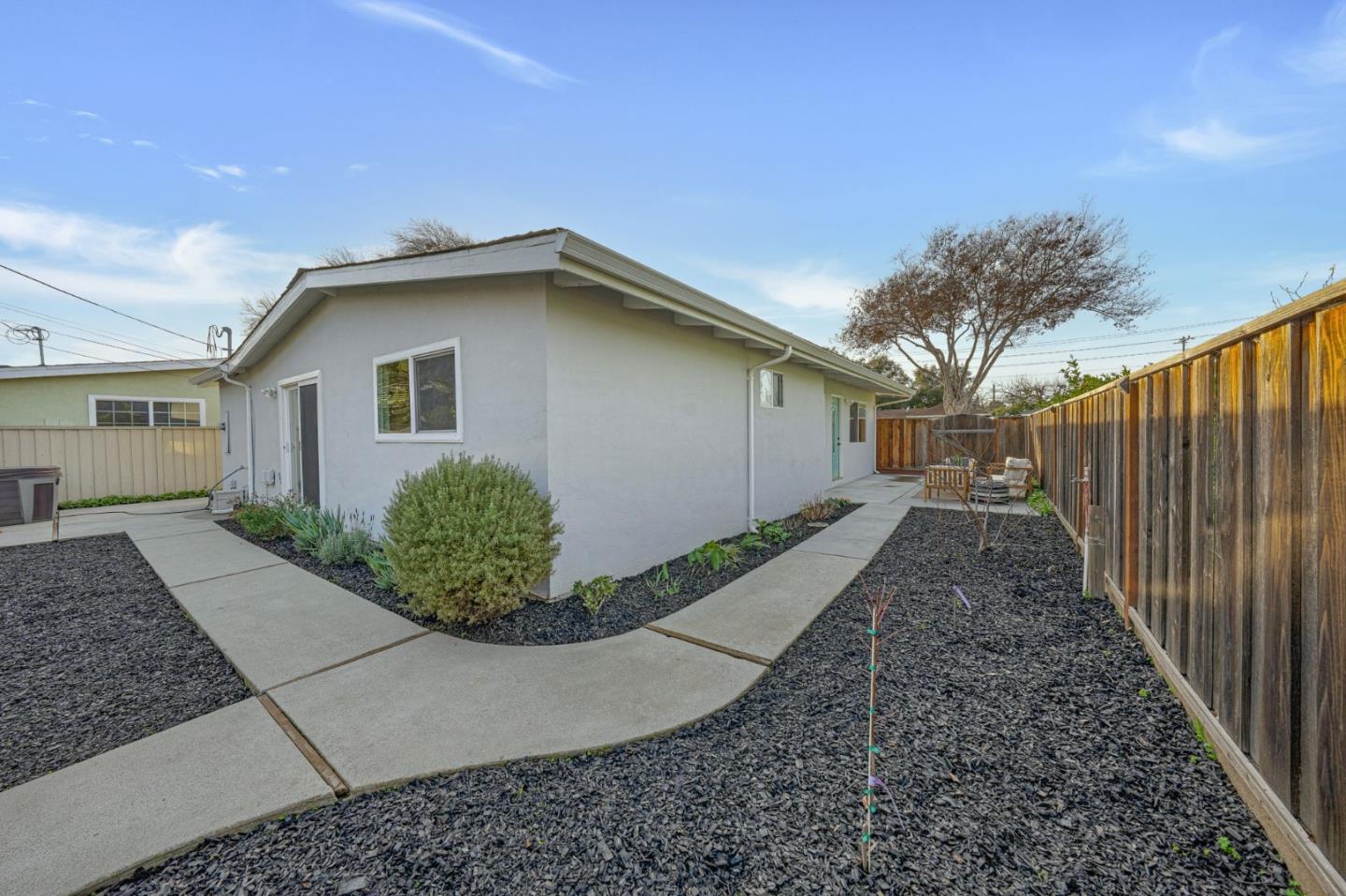 1775 Ravizza Avenue Santa Clara, CA 95051 - Photo 35 of 41 a view of a house with a small yard and plants
