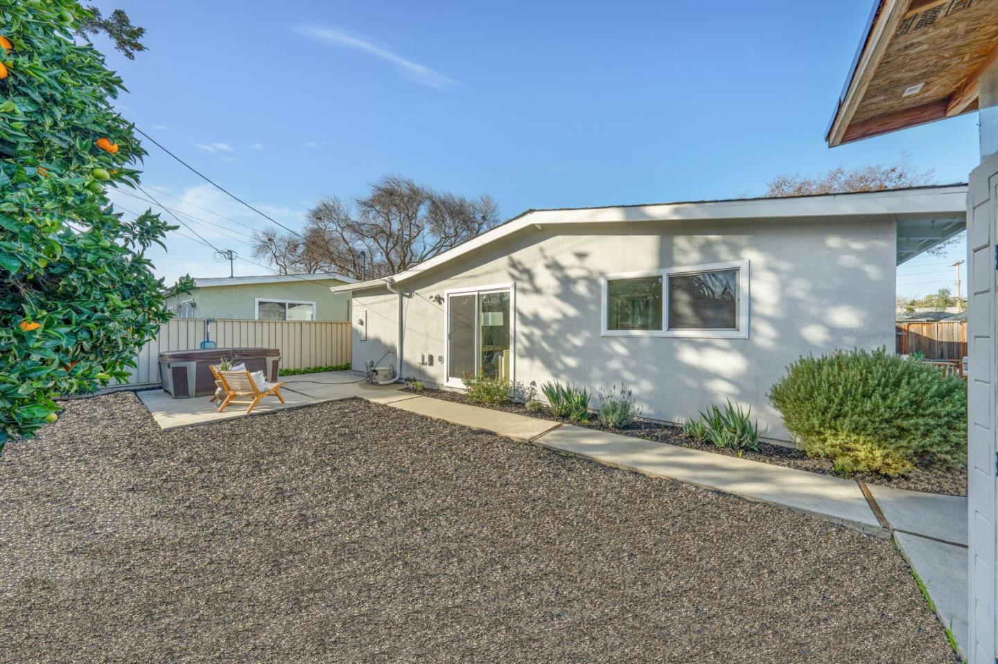 1775 Ravizza Avenue Santa Clara, CA 95051 - Photo 36 of 41 a front view of a house with a yard and potted plants