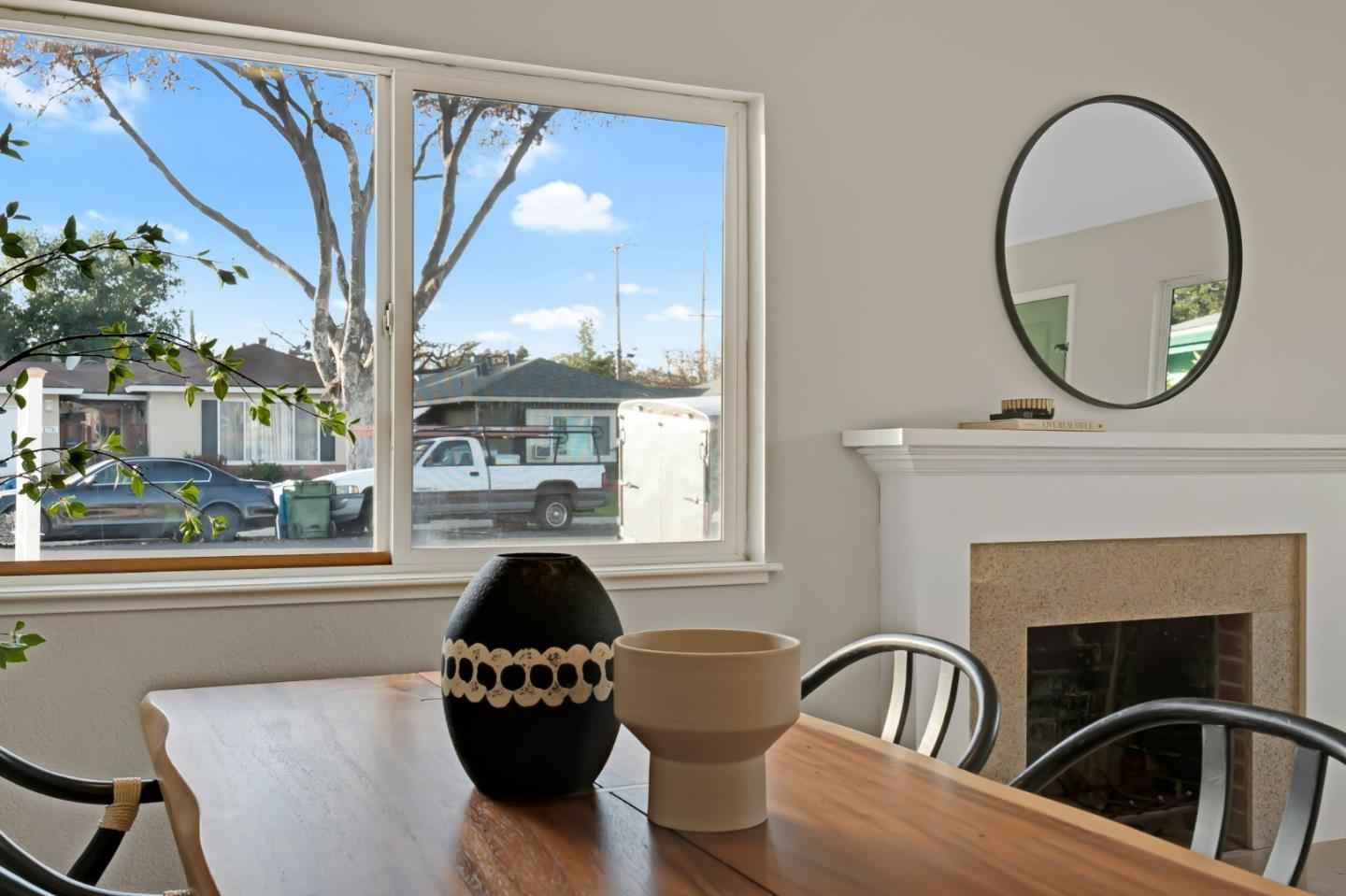 1775 Ravizza Avenue Santa Clara, CA 95051 - Photo 9 of 41 a living room with furniture a fireplace and a floor to ceiling window