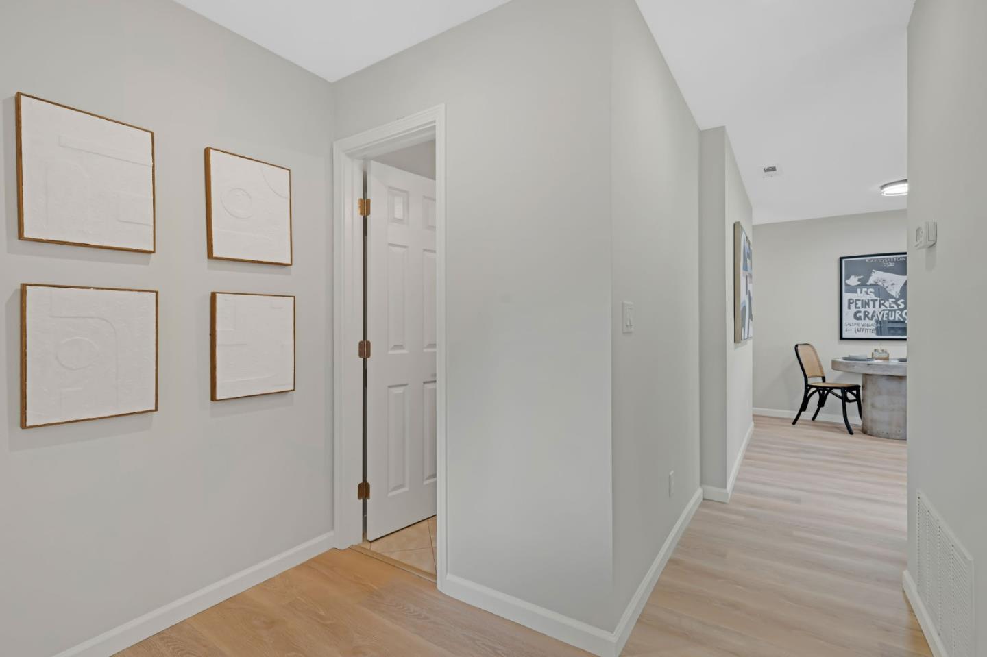 1775 Ravizza Avenue Santa Clara, CA 95051 - Photo 10 of 41 a view of a hallway with paintings on the wall