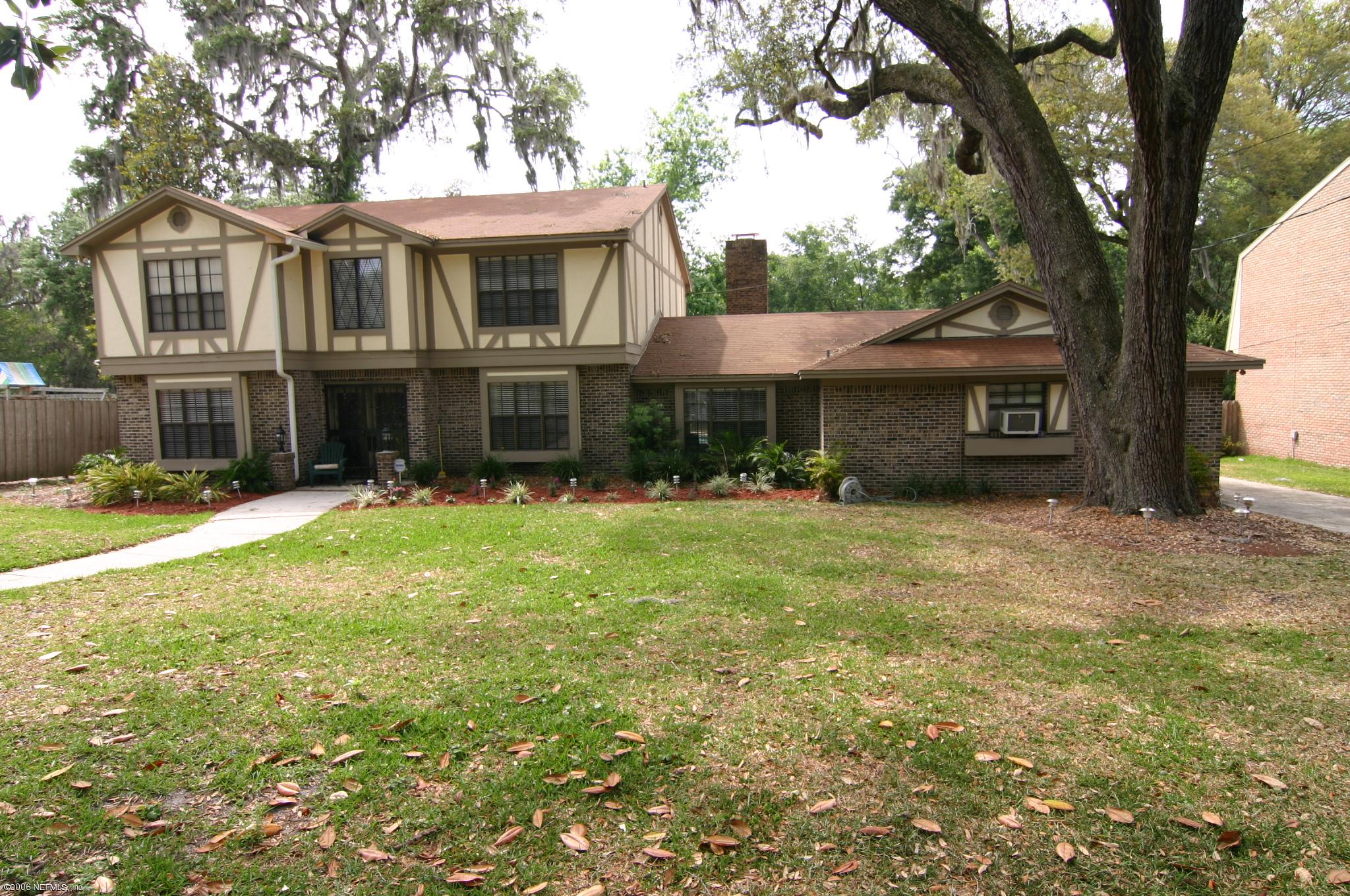 11743 Fort Caroline Road Jacksonville, FL 32225 - Photo 1 of 9 a front view of a house with garden