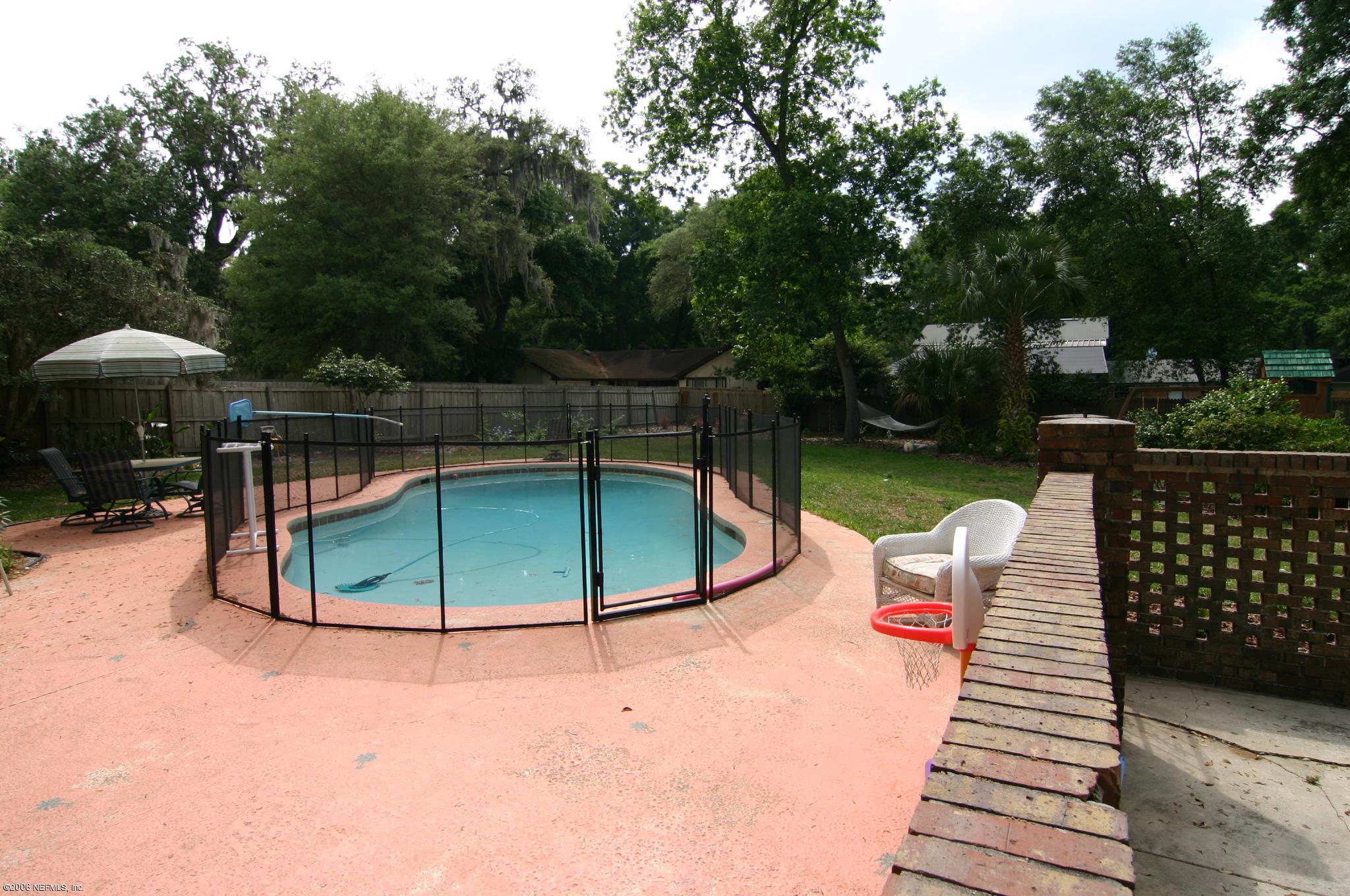 11743 Fort Caroline Road Jacksonville, FL 32225 - Photo 2 of 9 a view of a swimming pool with a lounge chairs