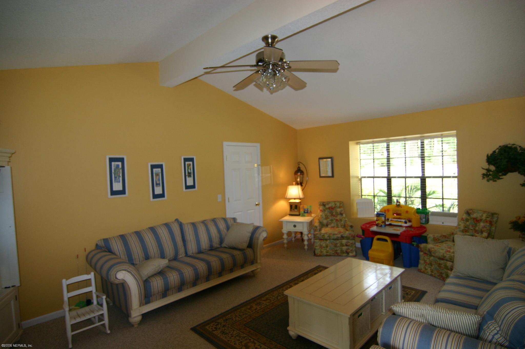 11743 Fort Caroline Road Jacksonville, FL 32225 - Photo 5 of 9 a living room with furniture and a window