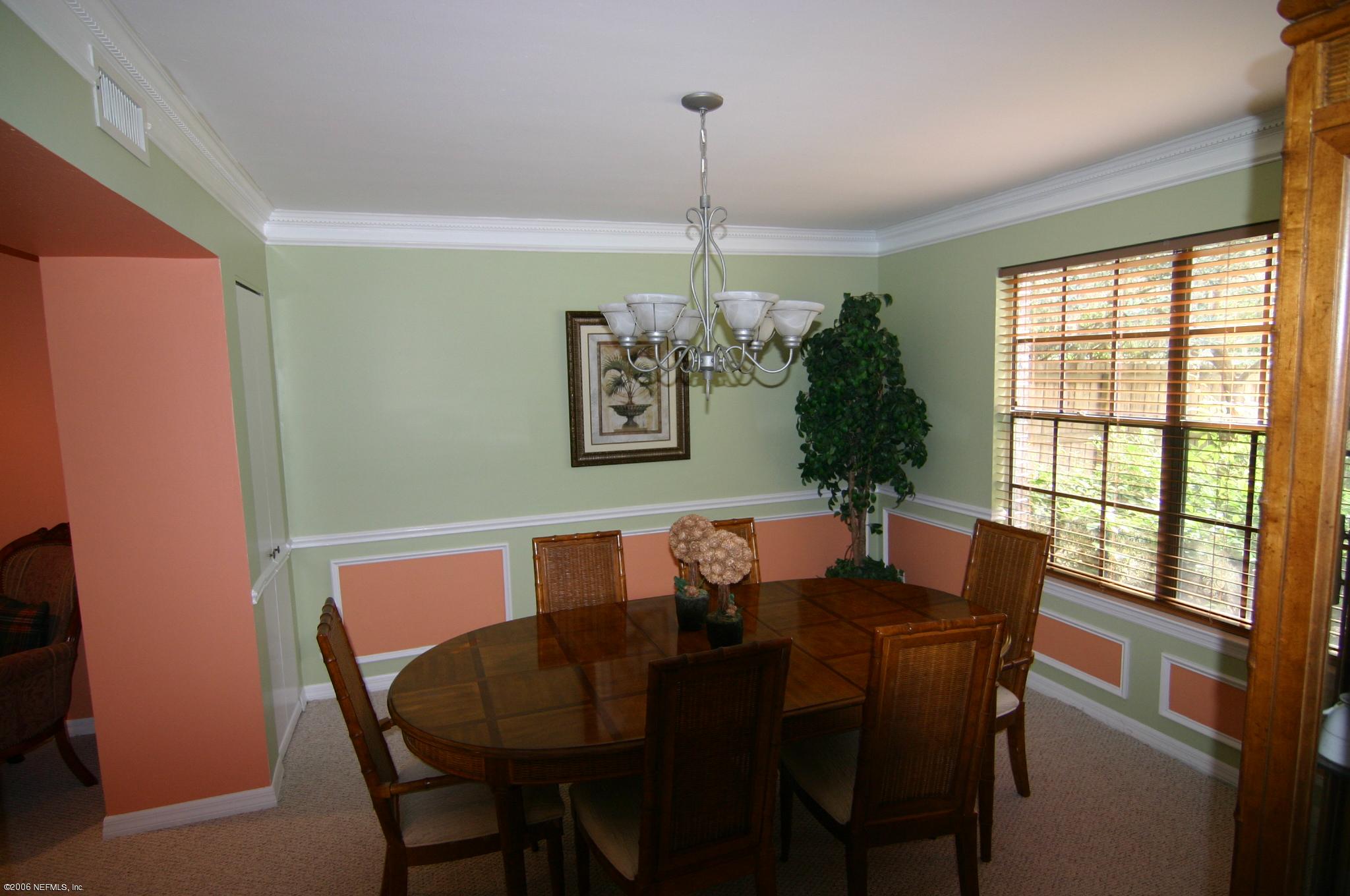 11743 Fort Caroline Road Jacksonville, FL 32225 - Photo 6 of 9 a view of a dining room with furniture window and outside view