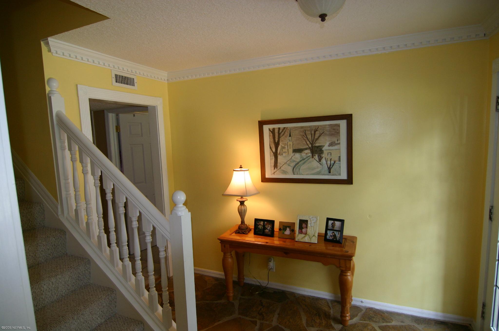 11743 Fort Caroline Road Jacksonville, FL 32225 - Photo 7 of 9 a view of a workspace with wooden floor and a cabinet
