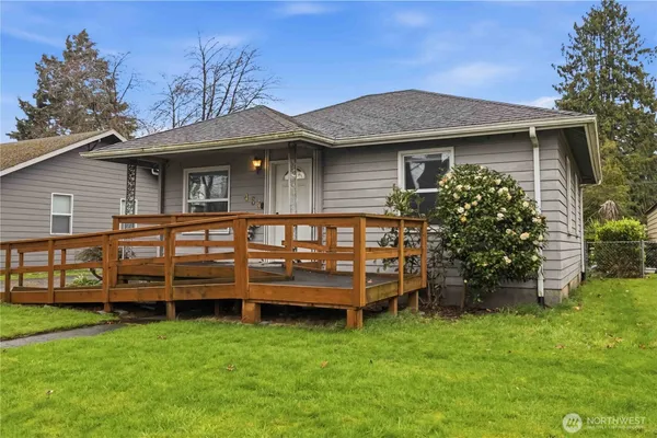 a front view of a house with a garden