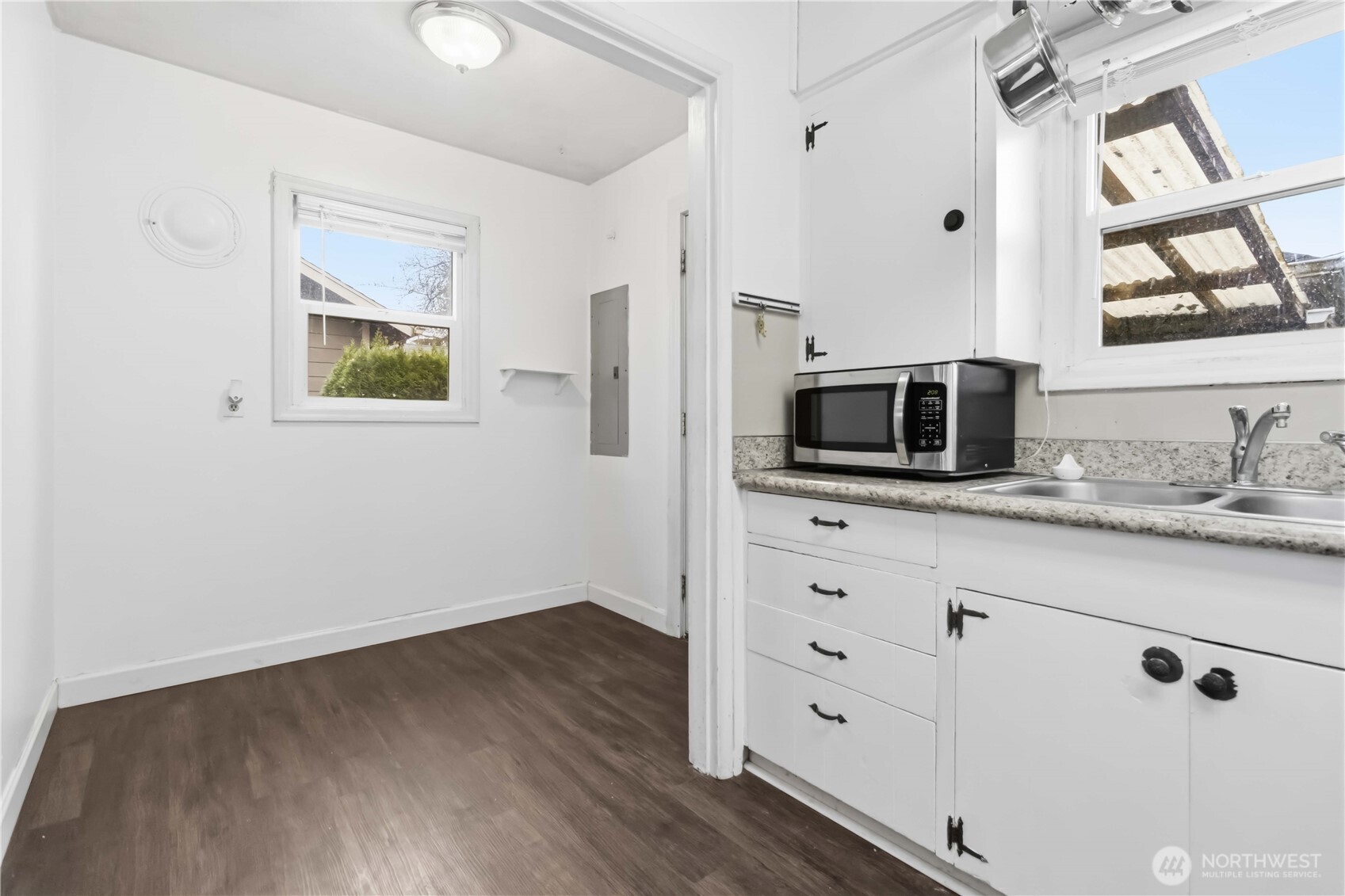 463 26th Avenue Longview, WA 98632 - Photo 11 of 28 a kitchen with stainless steel appliances a microwave a stove and white cabinets