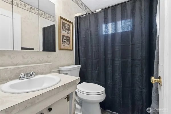 a view of a backyard with a garden and trees