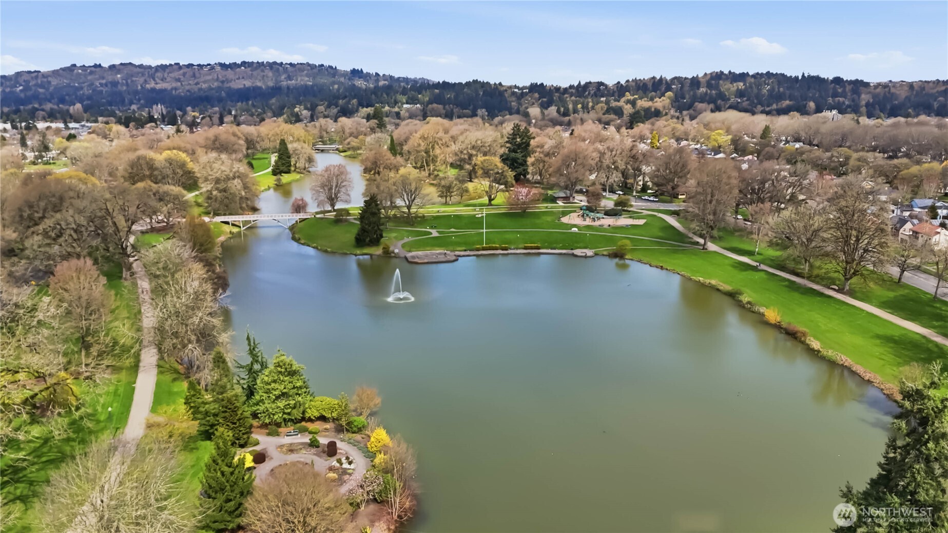 463 26th Avenue Longview, WA 98632 - Photo 27 of 28 an aerial view of green landscape with trees houses and lake view