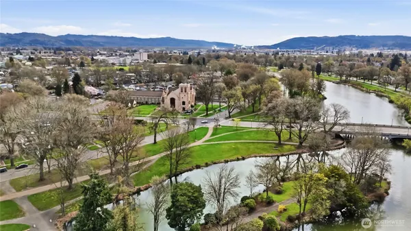 an aerial view of lake residential houses with outdoor space and swimming pool