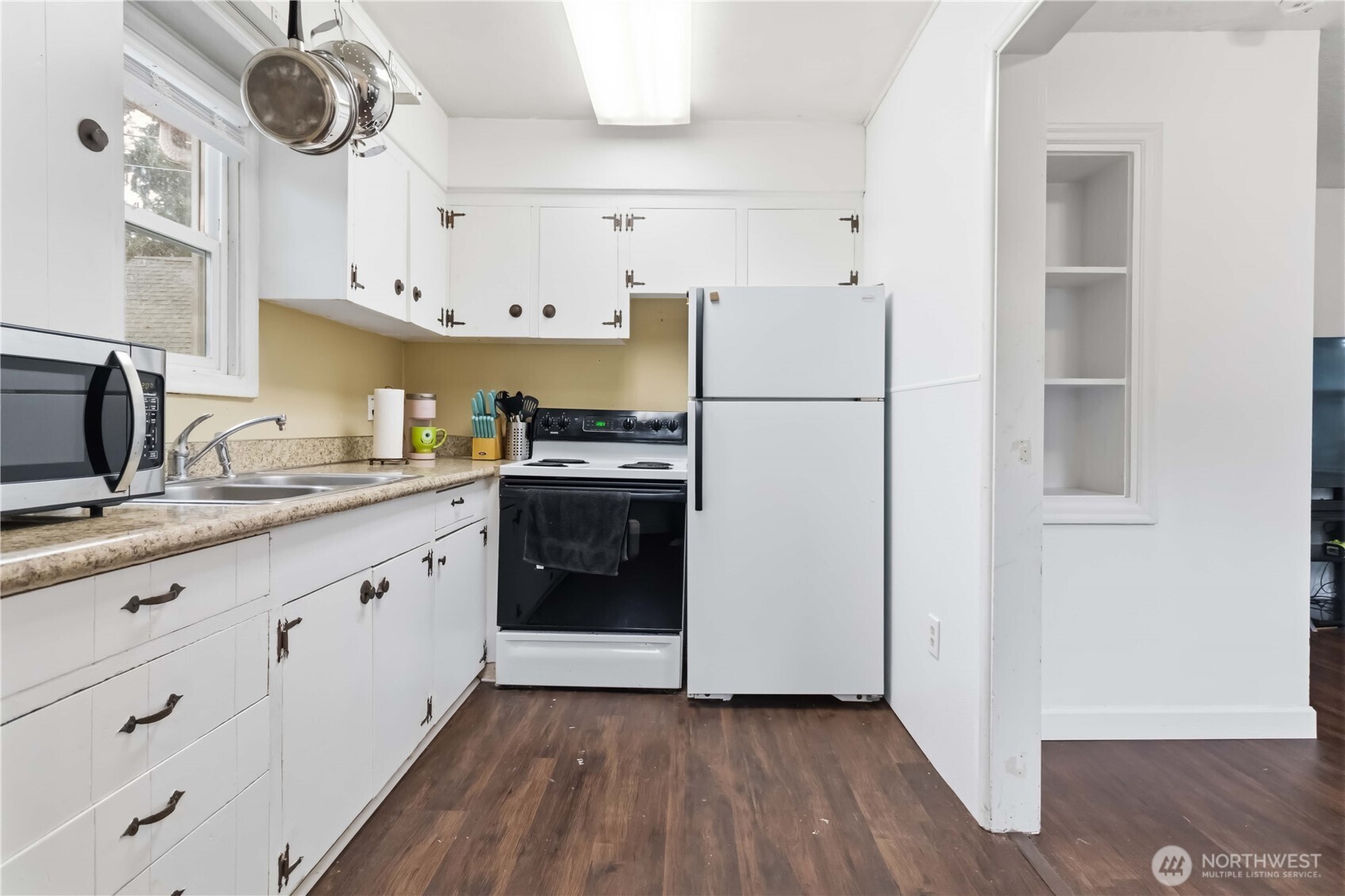 463 26th Avenue Longview, WA 98632 - Photo 9 of 28 a kitchen with stainless steel appliances a refrigerator sink and cabinets
